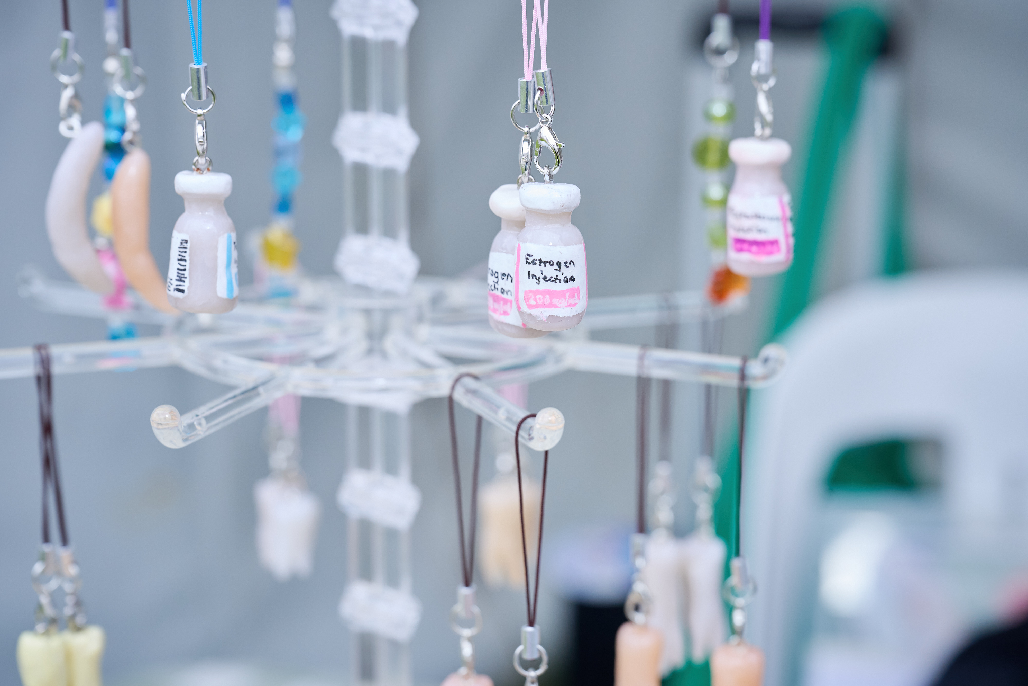 A photo of some handmade trinkets on a spinning display rack.